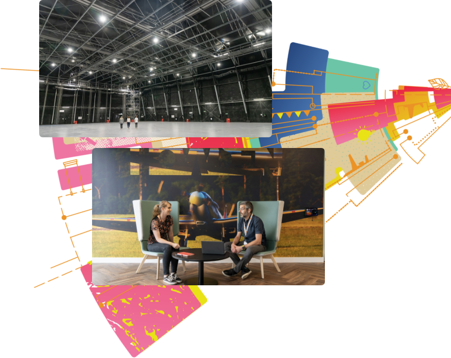 An empty hanger and 2 people sitting in a room