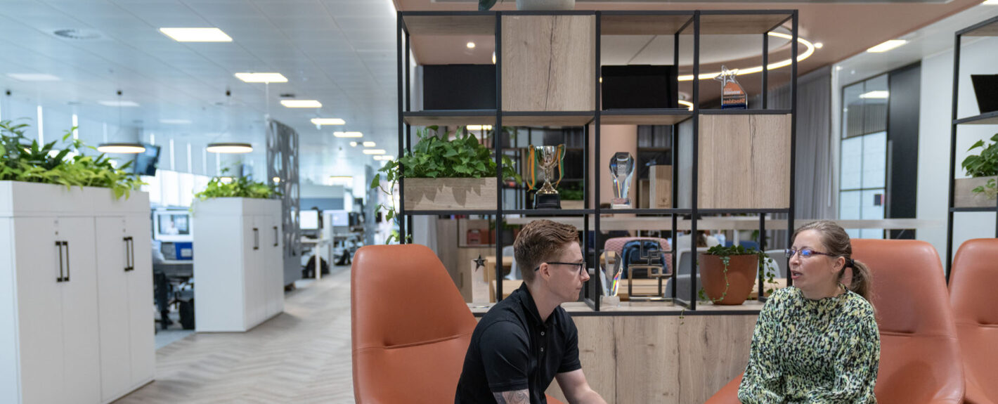 Two people sitting on an office